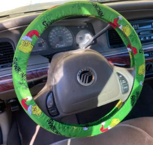 steering wheel cover with the Grinch on it