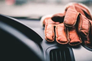 leather gloves on dashboard